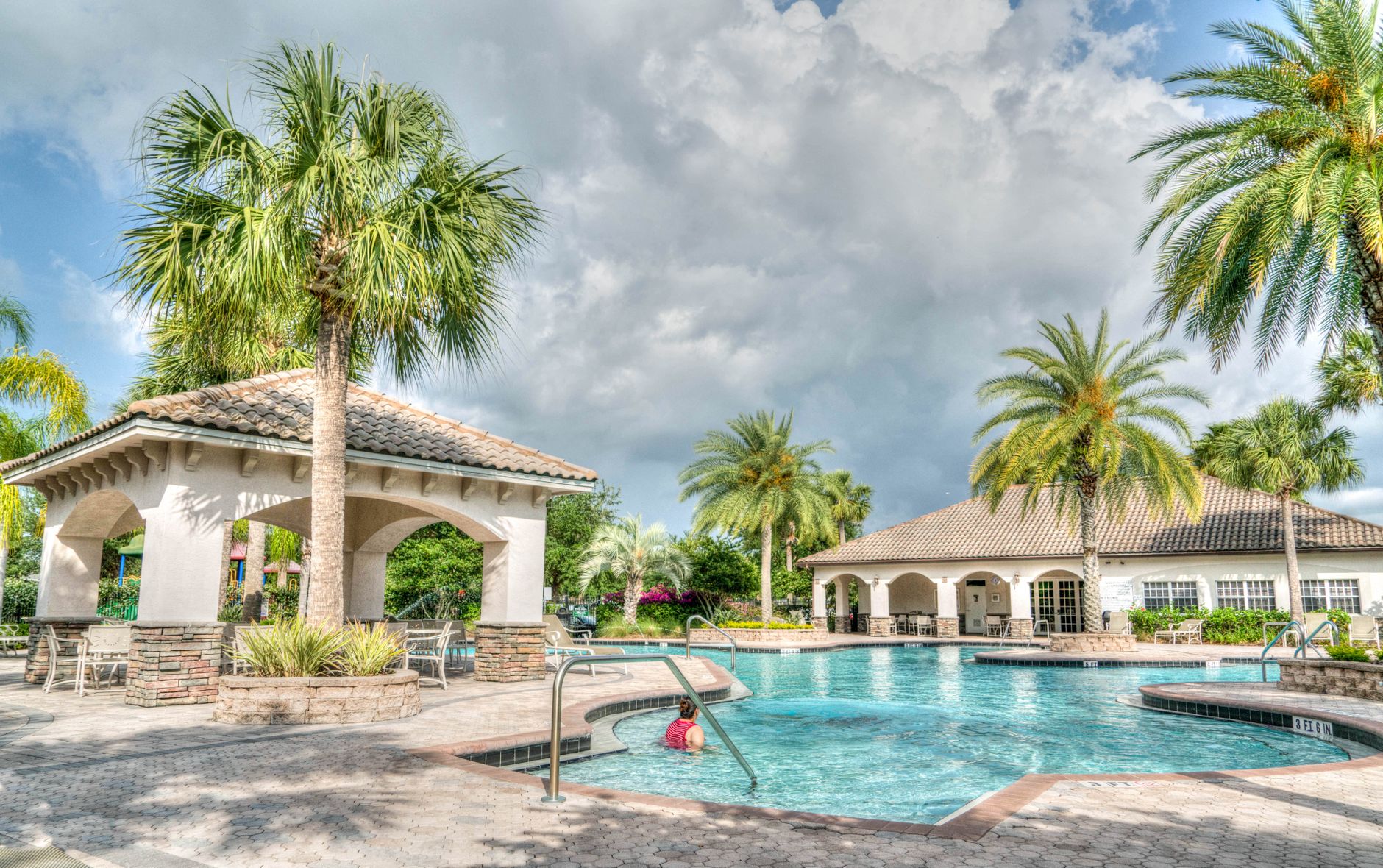 A crystal-clear pool serviced by Blue Paradise Pool Service